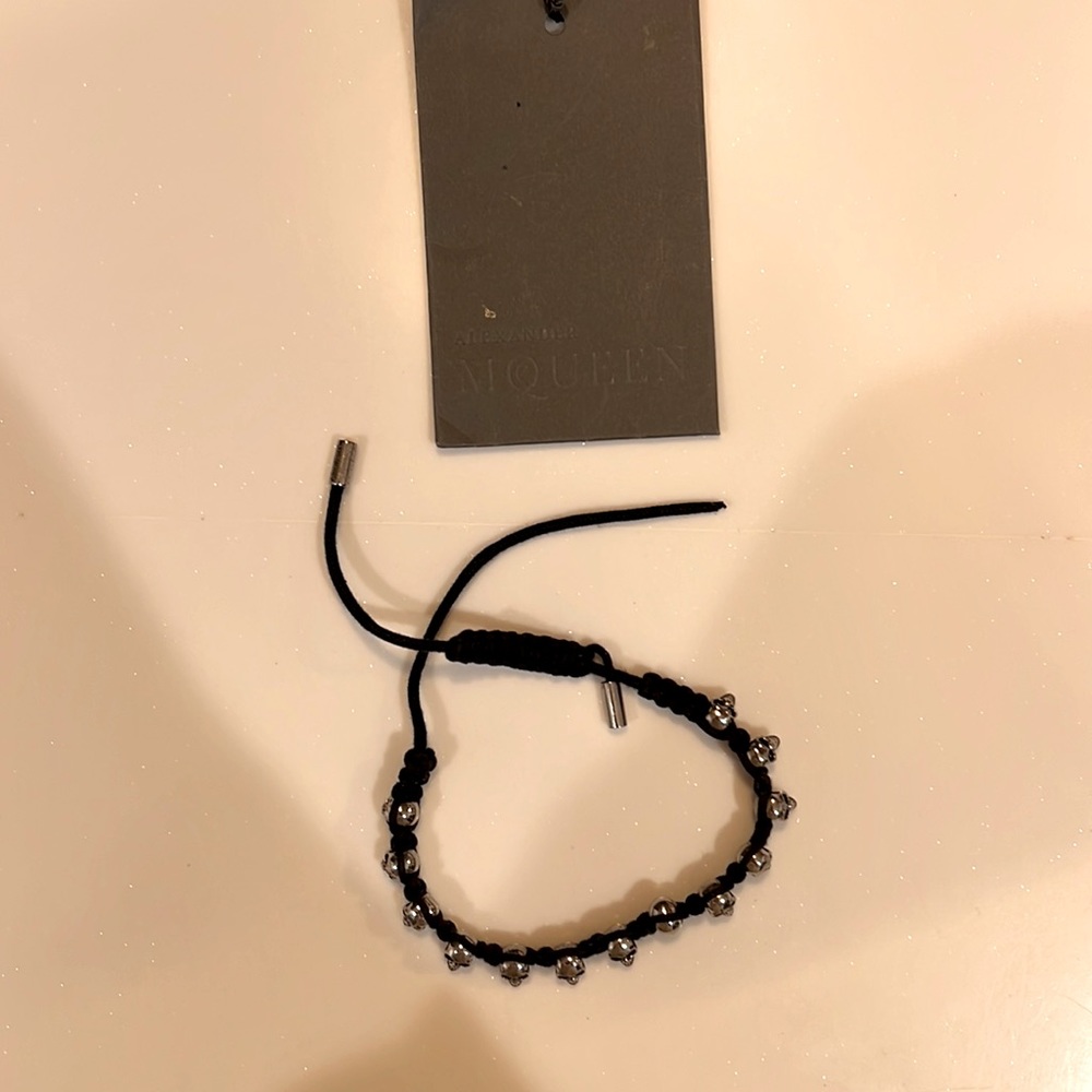 Alexander McQueen damaged black rope Mini Skull bracelet unisex style